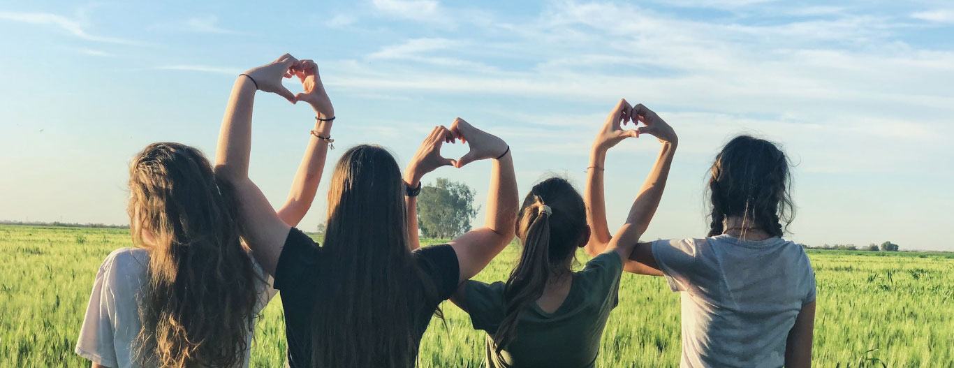 4 Girls, Arms Linked In Heart Shapes